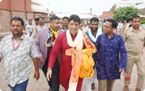 Govinda offering prayers at Jagannath Temple in Puri wearing traditional red kurta and white pajama