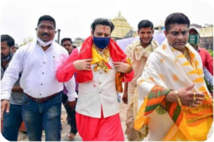 Govinda offering prayers at Jagannath Temple in Puri wearing traditional red kurta and white pajama