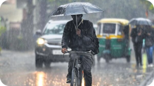 India weather update showing heatwave in north India and heavy rain with strong winds in northeast states